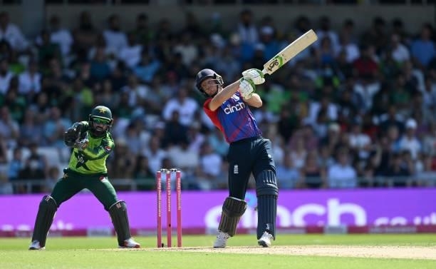 Jos Buttler of England bats watched by Pakistan wicketkeeper Mohammad Rizwan during the Second Vitality International T20 match between England and...