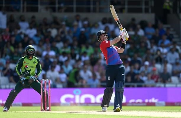 Liam Livingstone of England hits out for six runs watched by Pakistan wicketkeeper Mohammad Rizwan during the Second Vitality International T20 match...