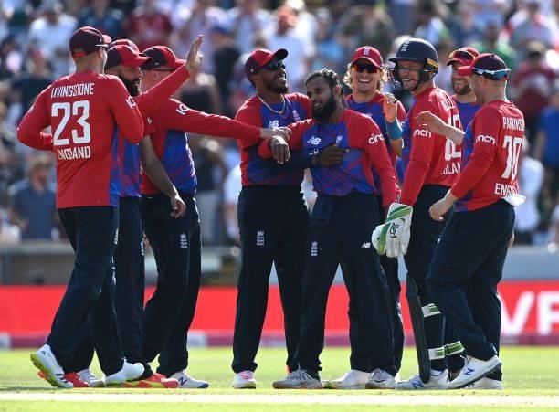 Adil Rashid of England celebrates with team mates after taking the wicket of Mohammad Rizwan of Pakistan during the second Vitality International T20...