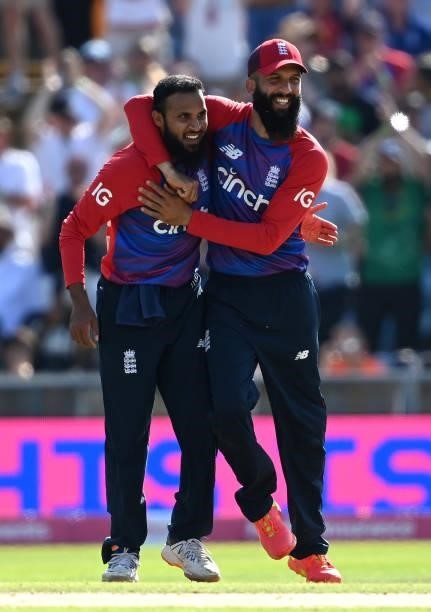 Adil Rashid of England celebrates with team mate Moeen Ali after taking the wicket of Mohammad Rizwan of Pakistan during the second Vitality...