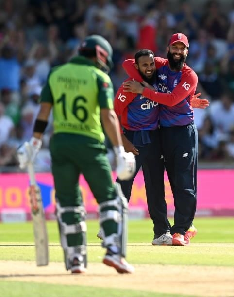 Adil Rashid of England celebrates with Moeen Ali after catching out Mohammad Rizwan of Pakistan from his own bowling during the Second Vitality...