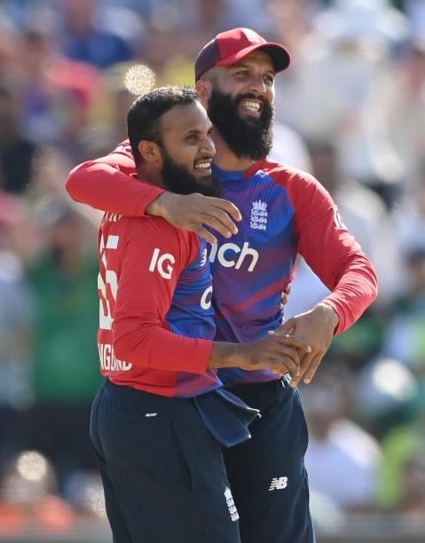 Adil Rashid of England is congratulated by Moeen Ali after dismissing Mohammad Rizwan of Pakistan during the 2nd Vitality T20 International between...