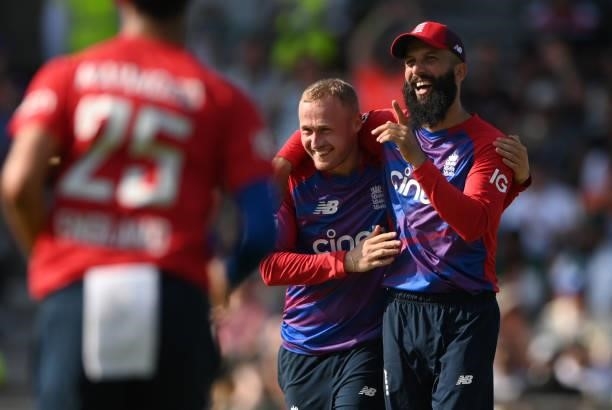 England bowler Matt Parkinson is congratulated by Moeen Ali after taking the wicket of Azam Khan during the Second Vitality Blast IT20 between...