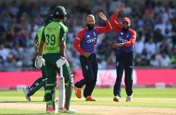 Moeen Ali of England celebrates with Adil Rashid after dismissing Mohammad Hafeez of Pakistan during the Second Vitality International T20 match...