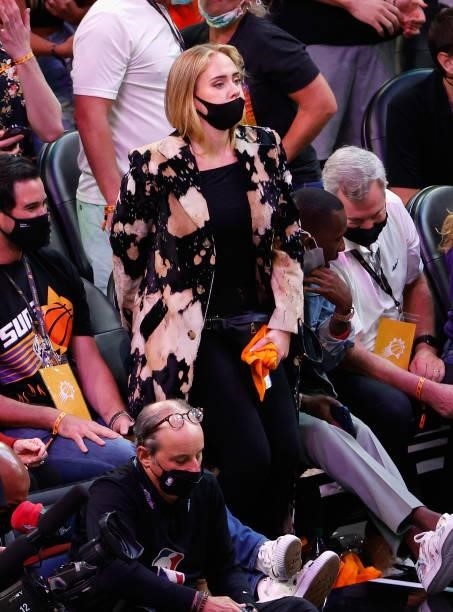 Singer Adele an Rich Paul attend game five of the NBA Finals at Footprint Center on July 17, 2021 in Phoenix, Arizona. The Bucks defeated the Suns...