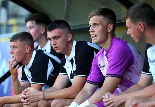 Oisin Mcentee and Will Brown of Newcastle United sit on the bench after the Pre-Season Friendly between Harrogate Town vs Newcastle United on July...