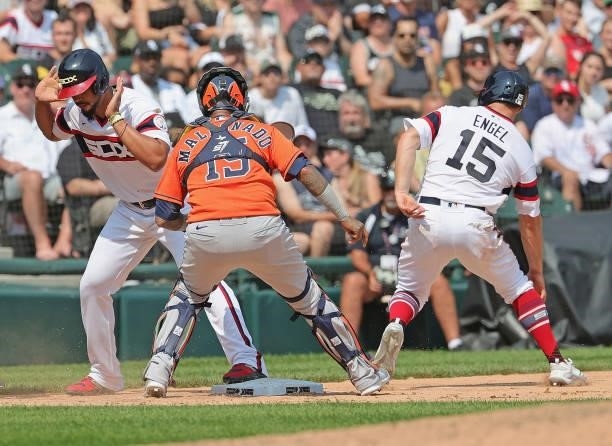 Martin Maldonado of the Houston Astros turns a double play against Jose Abreu and Adam Engel of the Chicago White Sox to end the 7th inning at...