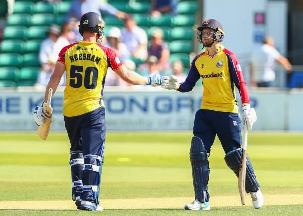 Josh Rymell of Essex Eagles interacts with Jimmy Neesham of Essex Eagles during the Vitality T20 Blast match between Essex Eagles and Middlesex at...