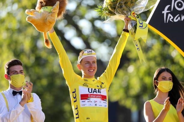 Race winner's Yellow Jersey Tadej Pogacar of Slovenia and UAE Team Emirates celebrates during the trophy ceremony of final stage 21 of the 108th Tour...
