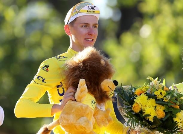 Race winner's Yellow Jersey Tadej Pogacar of Slovenia and UAE Team Emirates celebrates during the trophy ceremony of final stage 21 of the 108th Tour...