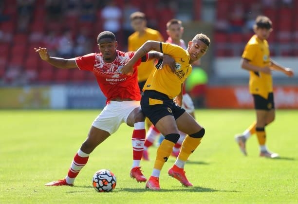 Chem Campbell of Wolverhampton Wanderers battles for the ball with Rio Adebisi of Crewe Alexandra during the Pre-Season friendly match between Crewe...