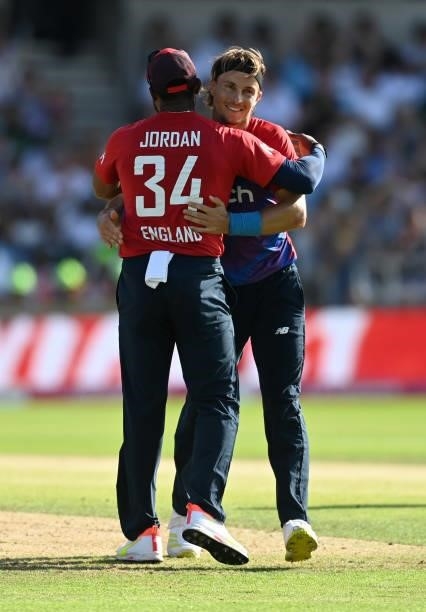 Tom Curran of England celebrates with Chris Jordan after dismissing Imad Wasim of Pakistan during the Second Vitality International T20 match between...
