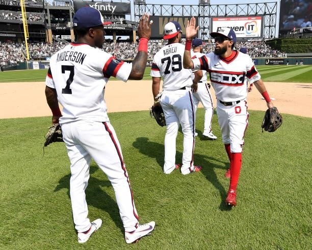 Tim Anderson, Billy Hamilton and members of the Chicago White Sox celebrate after the game against the Houston Astros on July 18, 2021 at Guaranteed...