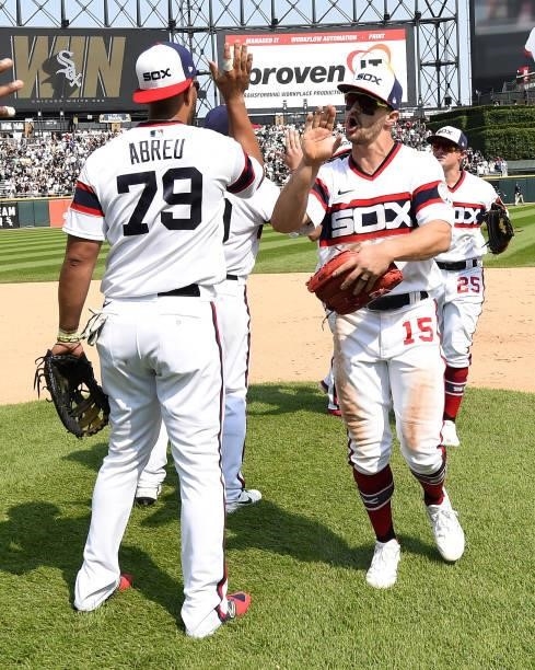 Jose Abreu, Adam Engel and Andrew Vaughn join members of the Chicago White Sox to celebrate after the game against the Houston Astros on July 18,...