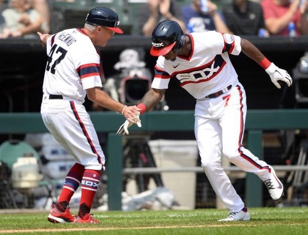 Tim Anderson celebrates with Third Base Coach Joe McEsing of the Chicago White Sox after hitting a home run in the fifth inning against the Houston...