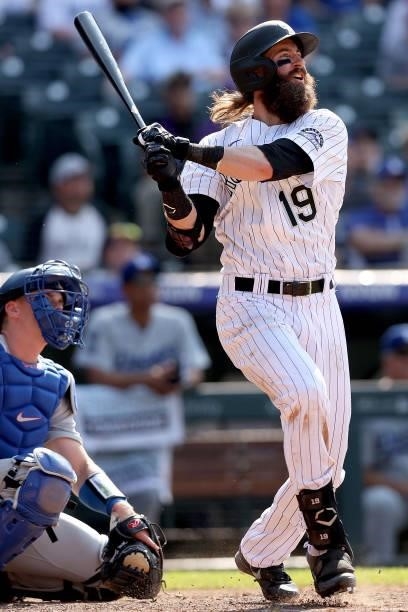 Charlie Blackmon of the Colorado Rockies hits a walk off home run against the Los Angeles Dodgers in the tenth inning at Coors Field on July 18, 2021...