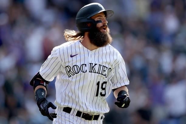 Charlie Blackmon of the Colorado Rockies circles the bases after hitting a walk off home run against the Los Angeles Dodgers in the tenth inning at...