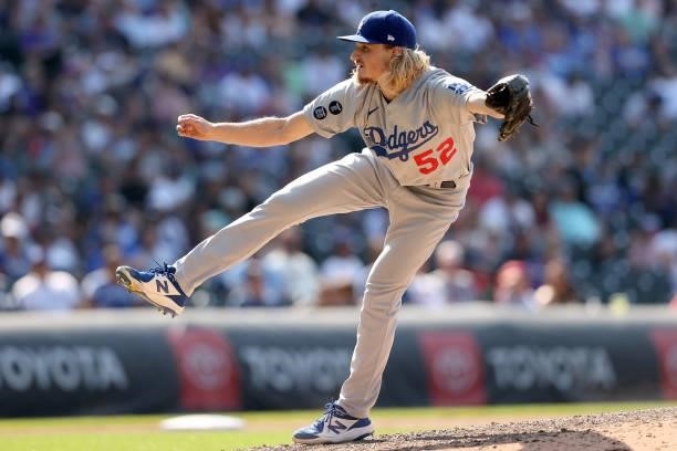 Pitcher Phil Bickford of the Los Angeles Dodgers throws against the Colorado Rockies in the tenth inning at Coors Field on July 18, 2021 in Denver,...