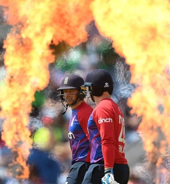 Jos Buttler and Jason Roy of England walk through some pyrotechnics and come out to bat in the 2nd Vitality T20 International between England and...