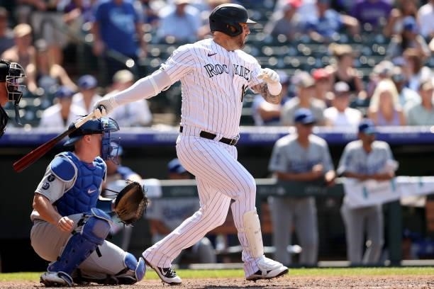 Pinch hitter Matt Adams of the Colorado Rockies hits a RBI single against the Los Angeles Dodgers in the seventh inning at Coors Field on July 18,...