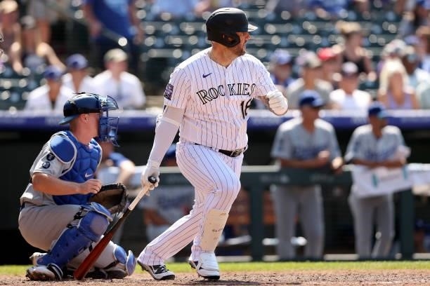 Pinch hitter Matt Adams of the Colorado Rockies hits a RBI single against the Los Angeles Dodgers in the seventh inning at Coors Field on July 18,...
