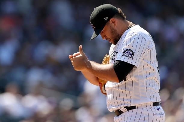 Pitcher Carlos Estevez of the Colorado Rockies throws against the Los Angeles Dodgers in the eighth inning at Coors Field on July 18, 2021 in Denver,...