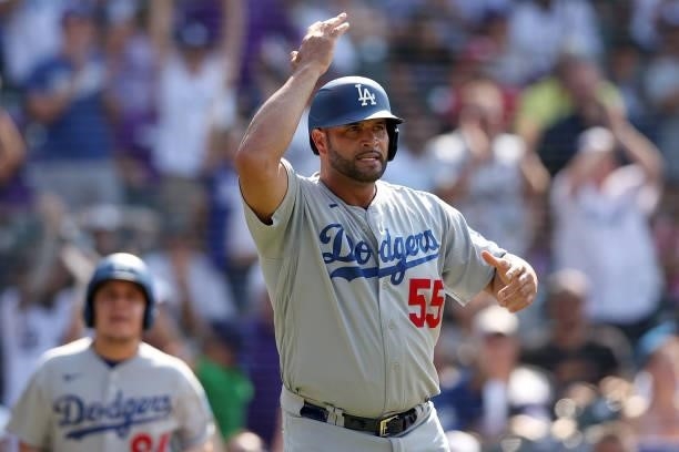 Albert Pujols of the Los Angeles Dodgers after scoring against the Colorado Rockies in the tenth inning at Coors Field on July 18, 2021 in Denver,...