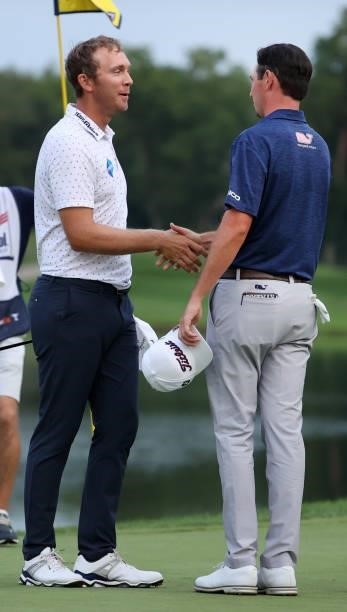 Seamus Power of Ireland reacts and shakes hands with J.T. Poston after putting in to win on the 18th hole during the sixth playoff hole during the...