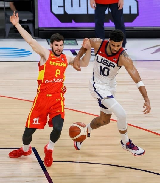 Jayson Tatum of the United States steals the ball from Dario Brizuela of Spain during an exhibition game at Michelob ULTRA Arena ahead of the Tokyo...