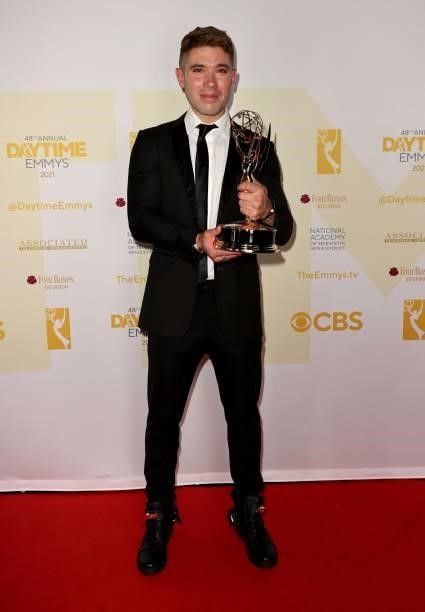Kristos Andrews poses with the award for Outstanding Performance by a Lead Actor in a Daytime Fiction Program for "The Bay
