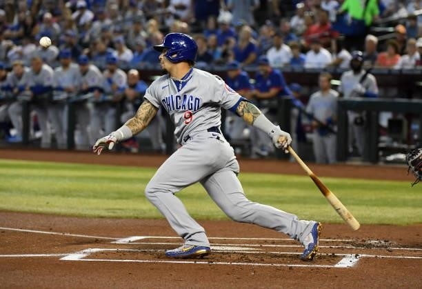Javier Baez of the Chicago Cubs follows through on a swing against the Arizona Diamondbacks at Chase Field on July 17, 2021 in Phoenix, Arizona.