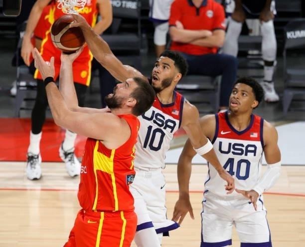 Marc Gasol of Spain is fouled by Jayson Tatum of the United States as Keldon Johnson of the United States defends during an exhibition game at...