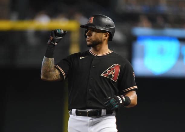 David Peralta of the Arizona Diamondbacks gestures to his bench after hitting a single against the Chicago Cubs at Chase Field on July 17, 2021 in...