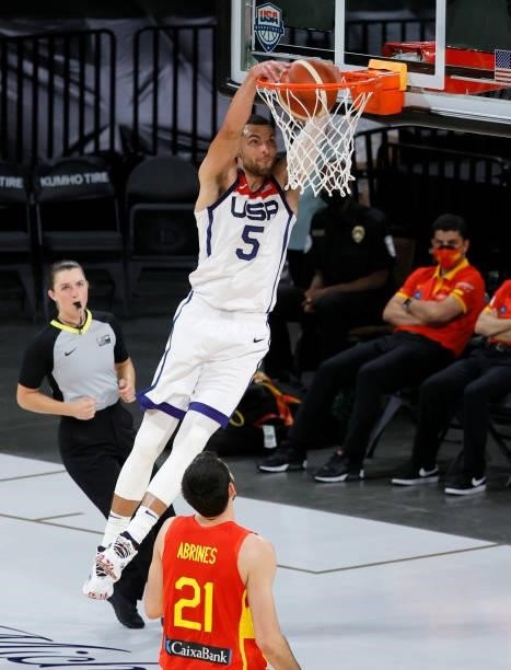 Zach LaVine of the United States dunks ahead of Alex Abrines of Spain during an exhibition game at Michelob ULTRA Arena ahead of the Tokyo Olympic...