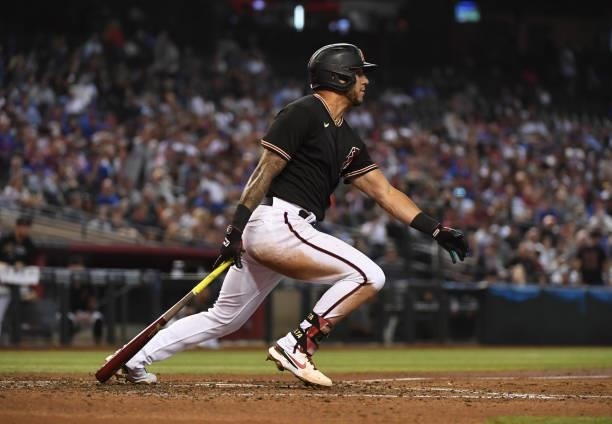 David Peralta of the Arizona Diamondbacks follows through on a swing against the Chicago Cubs at Chase Field on July 17, 2021 in Phoenix, Arizona.