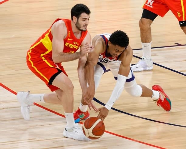 Keldon Johnson of the United States fouls Alex Abrines of Spain as they go after a loose ball during an exhibition game at Michelob ULTRA Arena ahead...