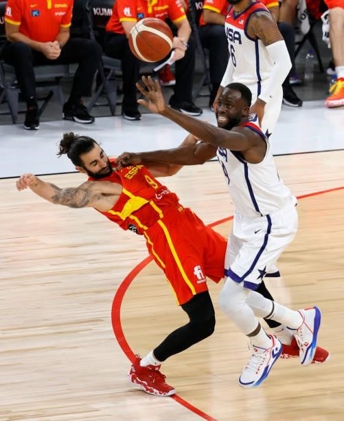 Draymond Green of the United States steals the ball from Ricky Rubio of Spain during an exhibition game at Michelob ULTRA Arena ahead of the Tokyo...
