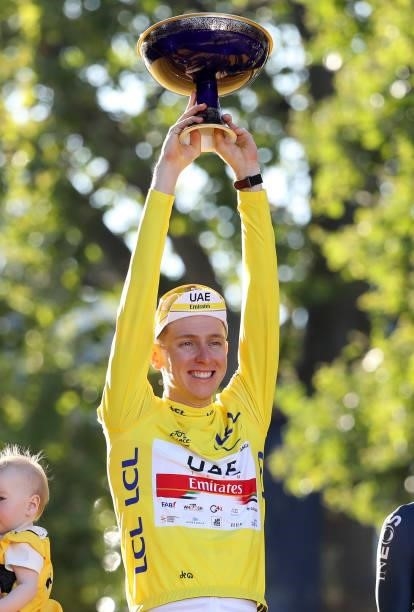 Yellow Jersey Tadej Pogacar of Slovenia and UAE Team Emirates celebrates winning the Tour during the trophy ceremony of final stage 21 of the 108th...