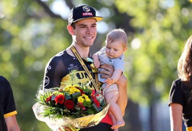 Wout van Aert of Belgium and Jumbo - Visma holding his 7 months year old son Georges van Aert celebrates during the trophy ceremony winning the final...