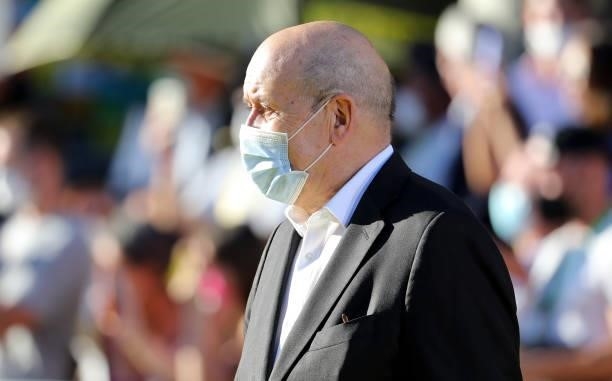 French Minister of Foreign Affairs Jean-Yves Le Drian during the trophy ceremony following the final stage 21 of the 108th Tour de France 2021, a...