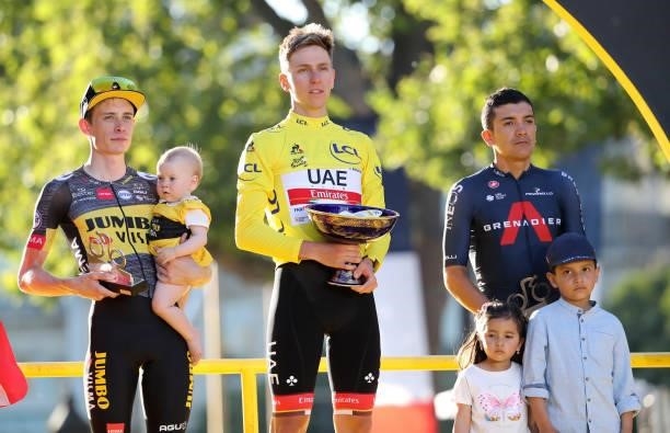 From left, second place of the Tour Jonas Vingegaard of Denmark and Jumbo - Visma , winner's Yellow Jersey Tadej Pogacar of Slovenia and UAE Team...