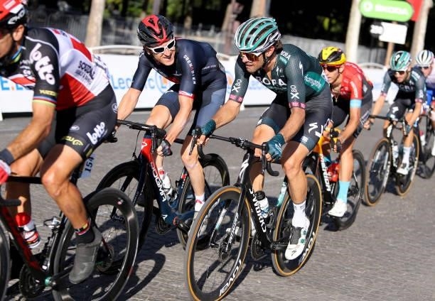Geraint Thomas of Great Britain and INEOS Grenadiers, Daniel Oss of Italy and Bora - Hansgrohe during the final stage 21 of the 108th Tour de France...