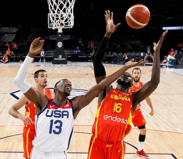 Bam Adebayo of the United States and Usman Garuba of Spain go for a rebound during an exhibition game at Michelob ULTRA Arena ahead of the Tokyo...