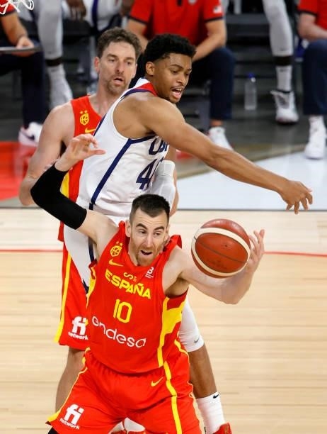 Keldon Johnson of the United States and Victor Claver of Spain fight for a rebound during an exhibition game at Michelob ULTRA Arena ahead of the...