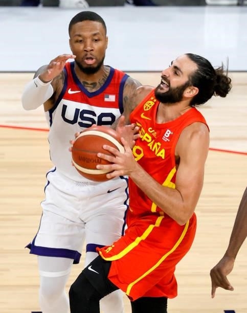 Ricky Rubio of Spain drives to the basket against Damian Lillard of the United States during an exhibition game at Michelob ULTRA Arena ahead of the...