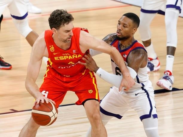 Pau Gasol of Spain is guarded by Damian Lillard of the United States during an exhibition game at Michelob ULTRA Arena ahead of the Tokyo Olympic...
