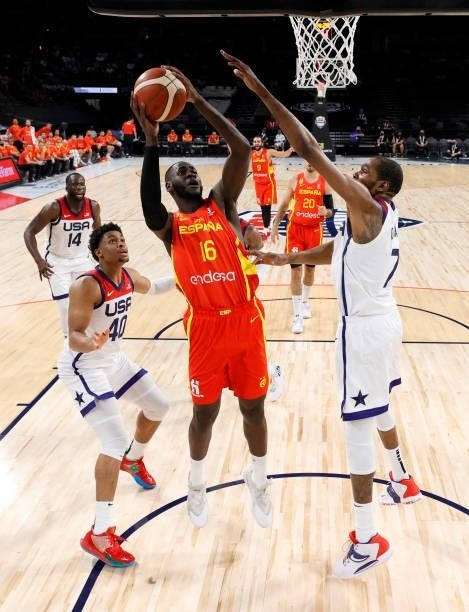 Usman Garuba of Spain shoots against Keldon Johnson and Kevin Durant of the United States during an exhibition game at Michelob ULTRA Arena ahead of...
