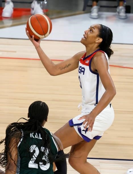 Ja Wilson of the United States drives to the basket against Ezinne Kalu of Nigeria during an exhibition game at Michelob ULTRA Arena ahead of the...