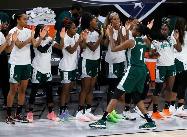 Elizabeth Williams of Nigeria high-fives teammates before an exhibition game against the United States at Michelob ULTRA Arena ahead of the Tokyo...