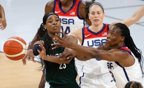Ezinne Kalu of Nigeria passes under pressure from Sue Bird and Sylvia Fowles of the United States during an exhibition game at Michelob ULTRA Arena...
